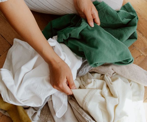 A calm and tidy space prepared for a home workout with a mat and comfortable clothes.